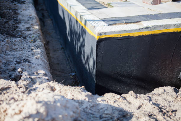 Professional Waterproofing technician working in Wolflake, IN